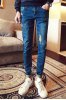 MID-RISE WAISTED EMBROIDRED JEANS